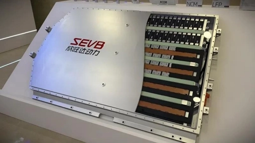 EV battery module on display with internal cell layers visible and SEVB branding on the outer casing